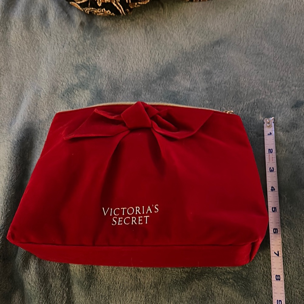 Victoria’s Secret cosmetic/wristlet bag.